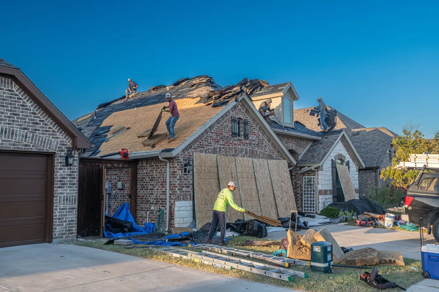 Roof work on a brick house in Fort Worth, Tarrant County