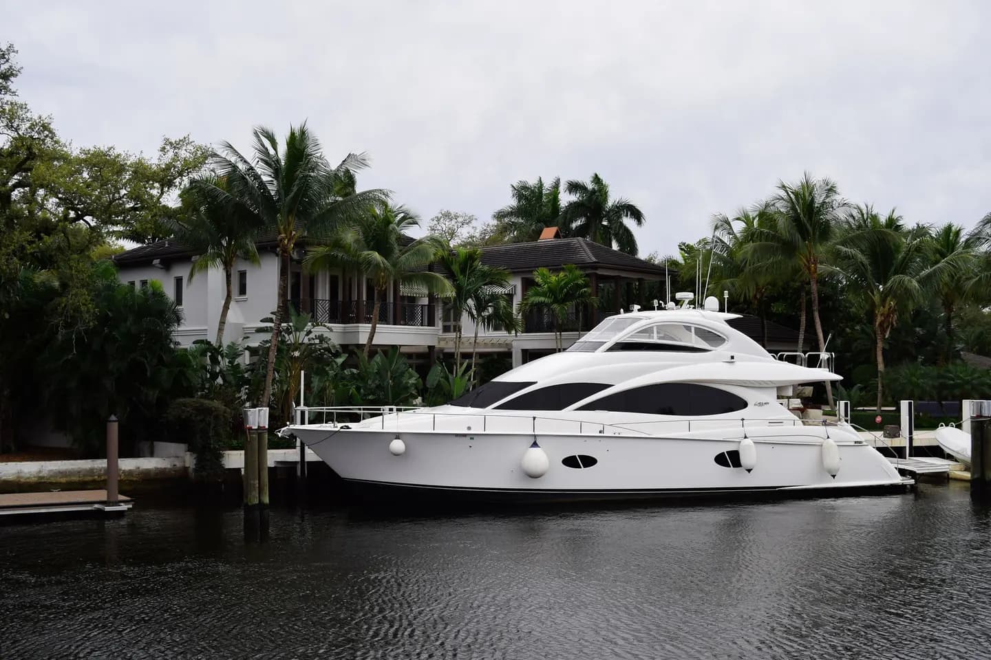 A yacht moored beside waterfront homes on a Fort Lauderdale canal