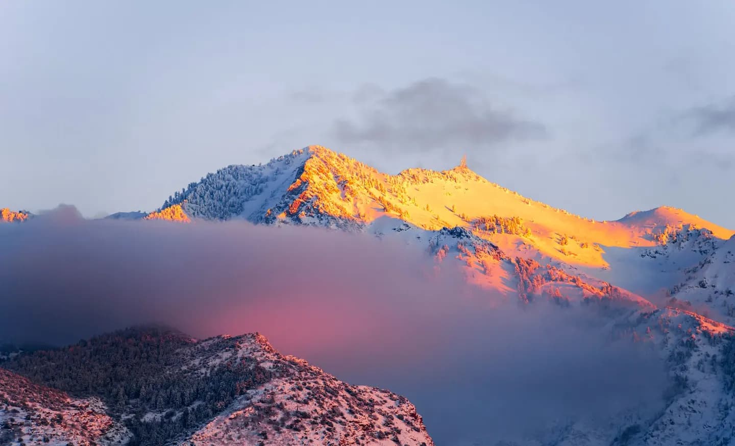 Sunrise on snow-capped mountains above Ogden, Utah