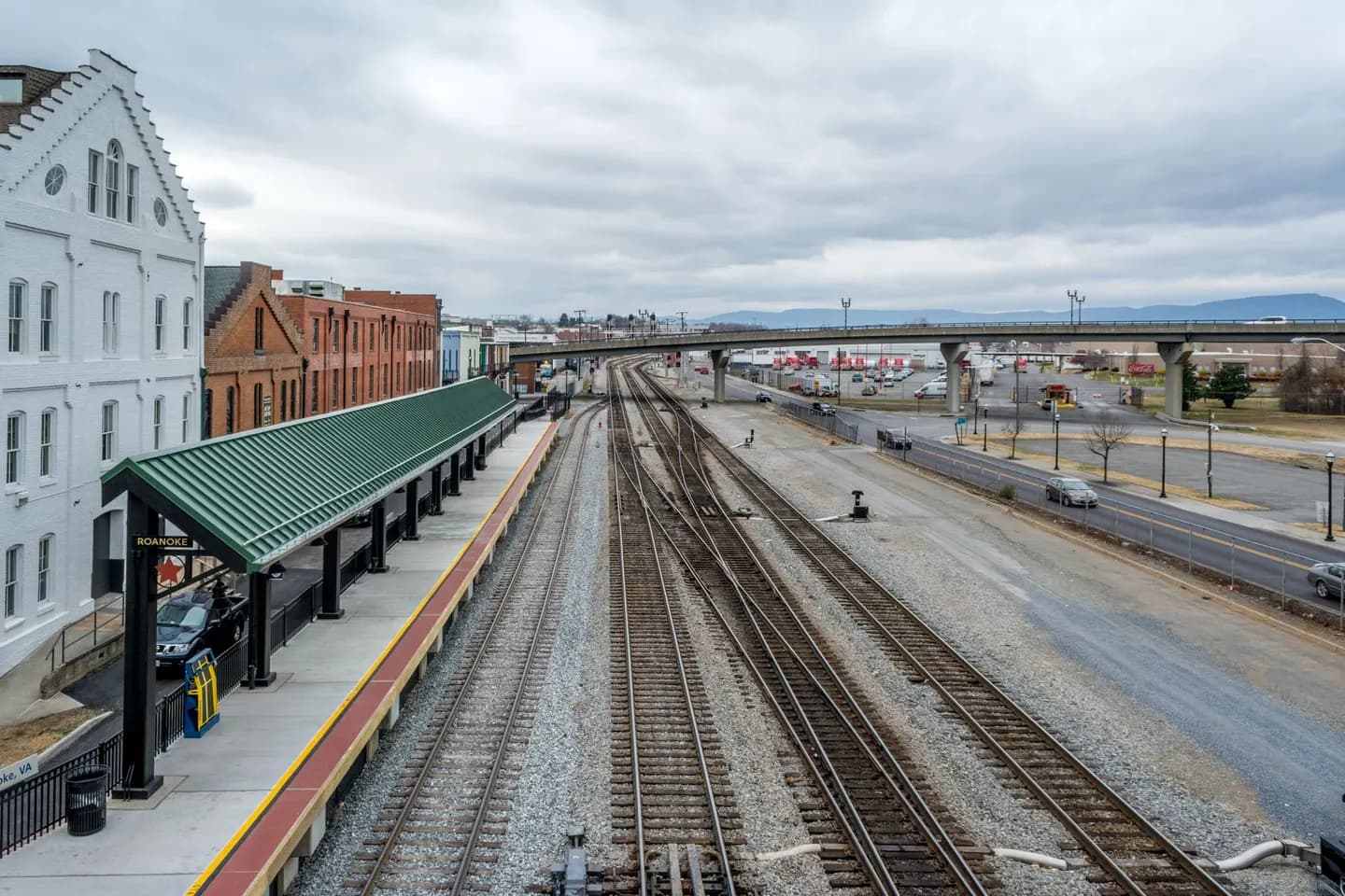 The train platform and tracks at Roanoke, Virginia, with mountains beyond