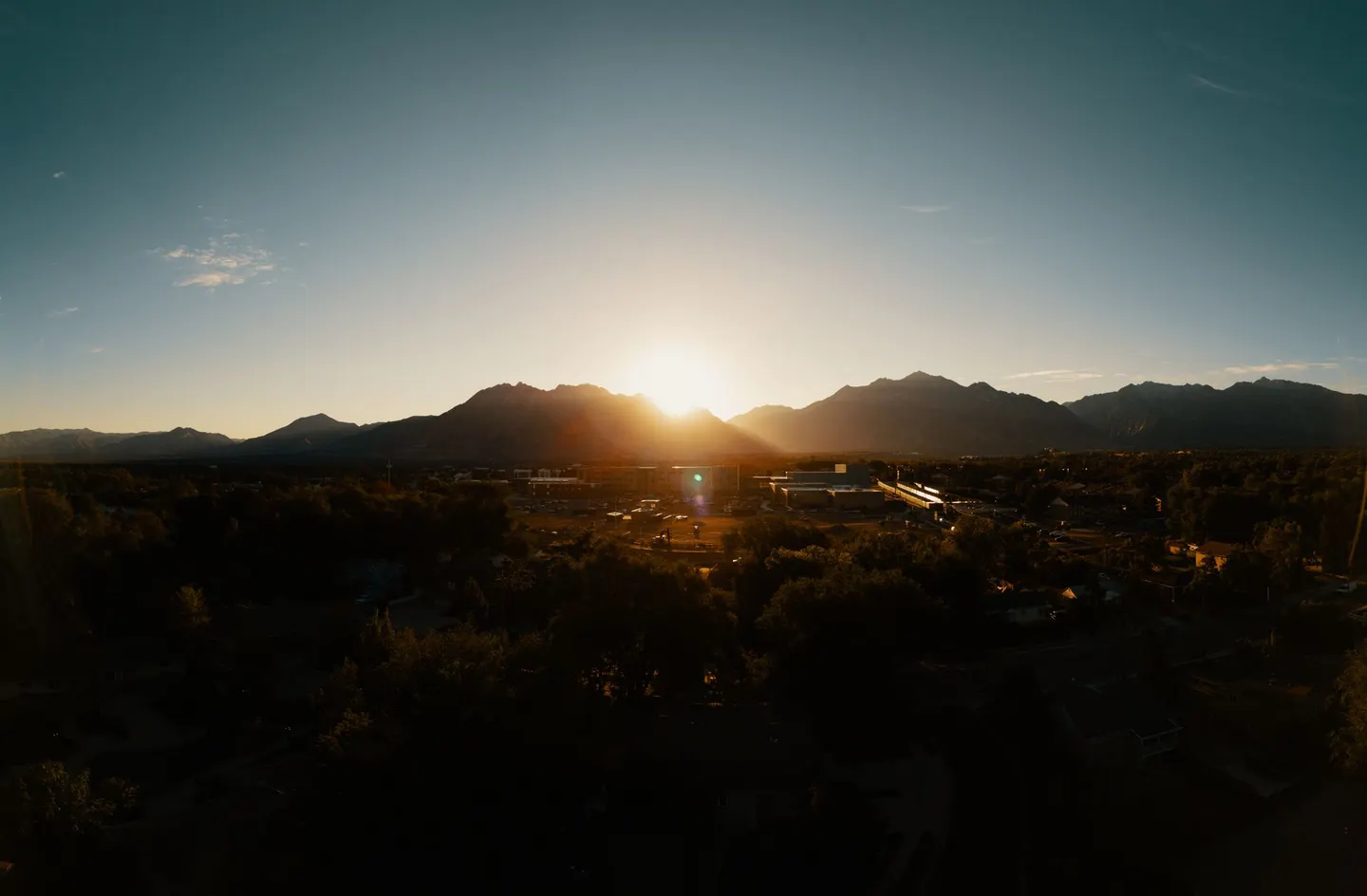 Sunset behind the mountains in Sandy, Utah