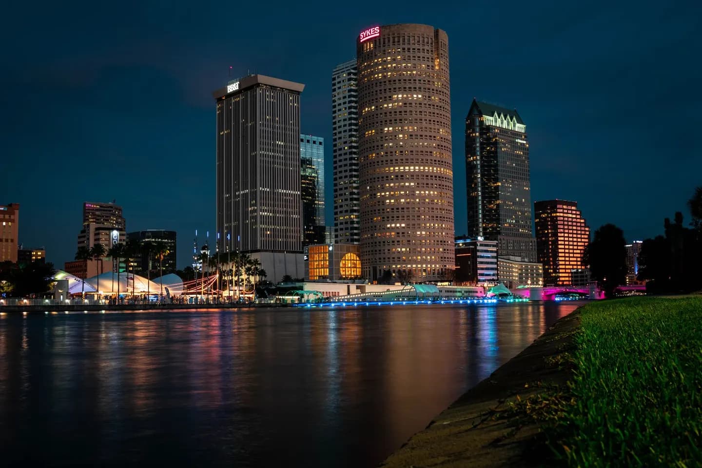 The Tampa skyline at night, reflected in the river